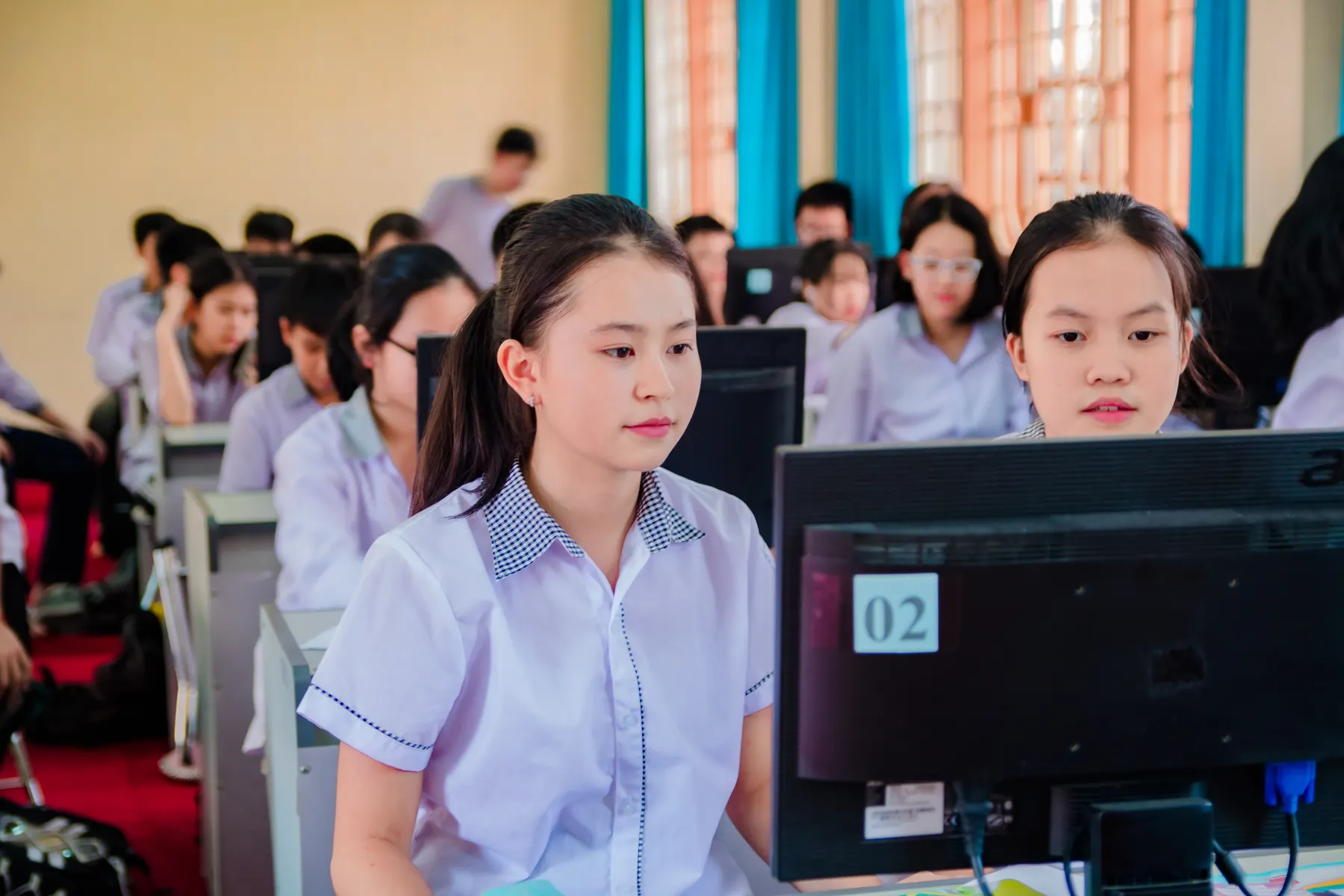 High school students learning digital skills in a computer lab